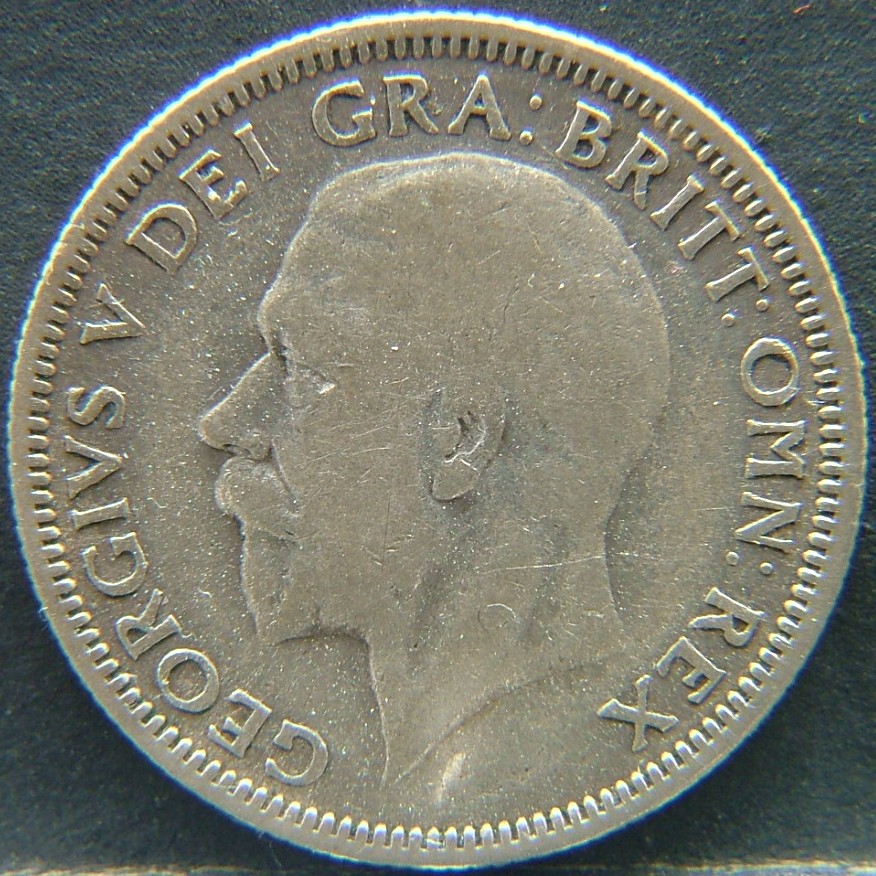 Front side of 🇬🇧 United Kingdom – Monarchs and Milestones 1 Shilling 1931 coin