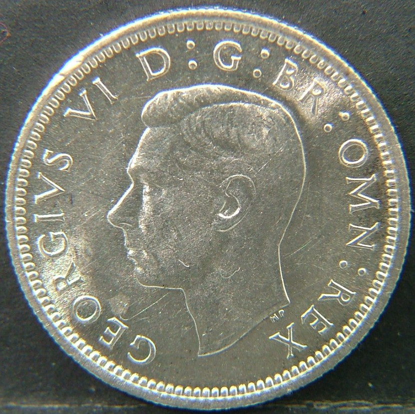 Back side of 🇬🇧 United Kingdom – Monarchs and Milestones 6 Pence  1945 object