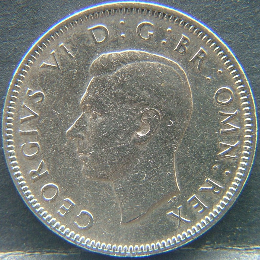 Front side of 🇬🇧 United Kingdom – Monarchs and Milestones 1 Shilling Eng 1948 coin