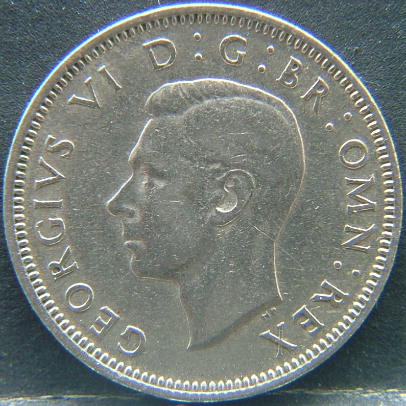 Front side of 🇬🇧 United Kingdom – Monarchs and Milestones 1 Shilling Scot 1949 coin