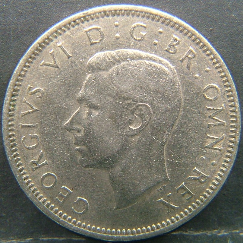Back side of 🇬🇧 United Kingdom – Monarchs and Milestones 1 Shilling Scot  1949 object