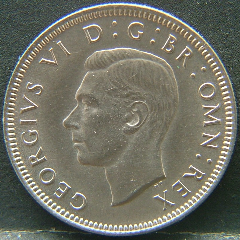 Front side of 🇬🇧 United Kingdom – Monarchs and Milestones 1 Shilling Scot 1948 coin
