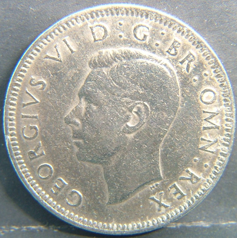 Front side of 🇬🇧 United Kingdom – Monarchs and Milestones 1 Shilling Scot 1949 coin