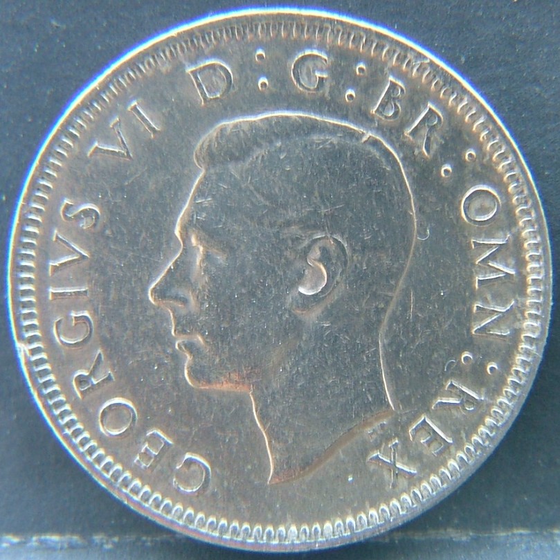 Back side of 🇬🇧 United Kingdom – Monarchs and Milestones 1 Shilling Scot  1949 object