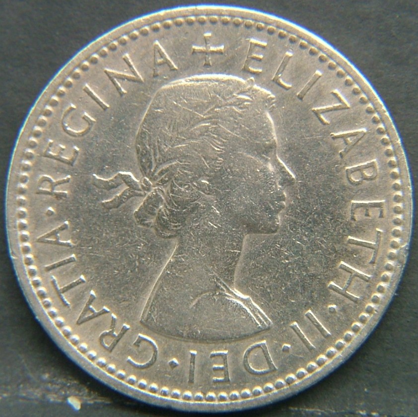 Back side of 🇬🇧 United Kingdom – Monarchs and Milestones 1 Shilling Scot 1954 coin