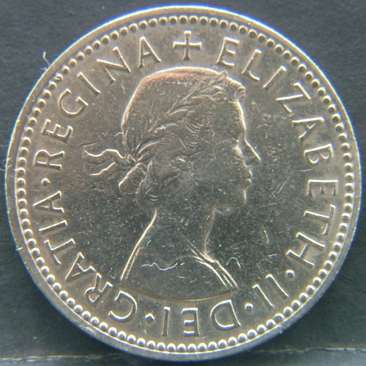 Front side of 🇬🇧 United Kingdom – Monarchs and Milestones 1 Shilling Eng 1961 coin