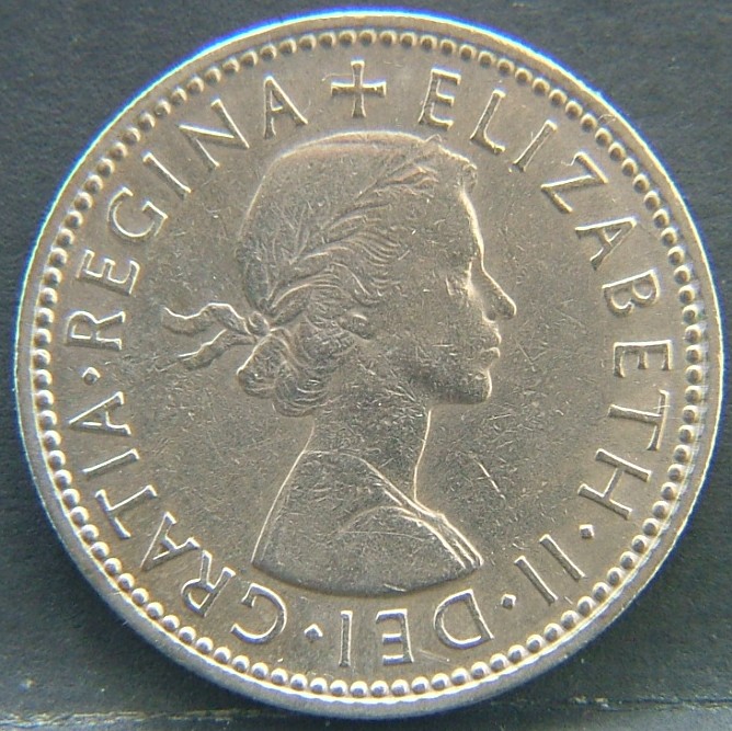 Front side of 🇬🇧 United Kingdom – Monarchs and Milestones 1 Shilling 1963 coin