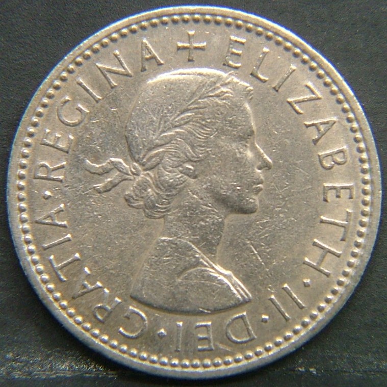 Back side of 🇬🇧 United Kingdom – Monarchs and Milestones 1 Shilling 1963 coin